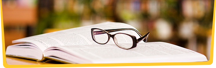 Glasses sitting on open book