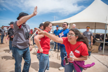 Excited students outside pointing